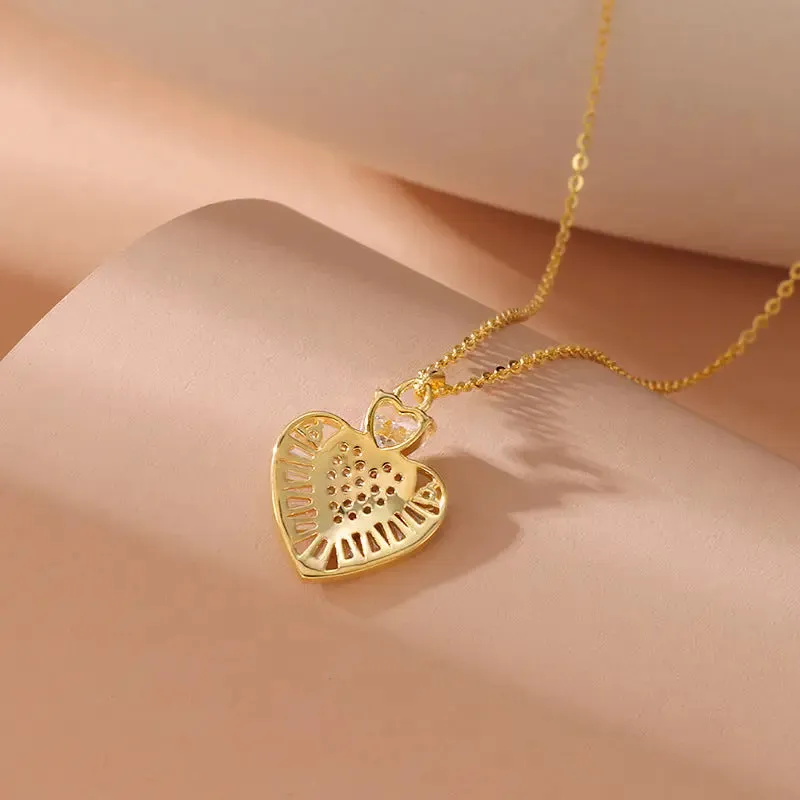 LOVCIA Gold Plated Sterling Silver Heart Pendant Necklace for Women With Pavé and Baguette-Cut Crystal Design