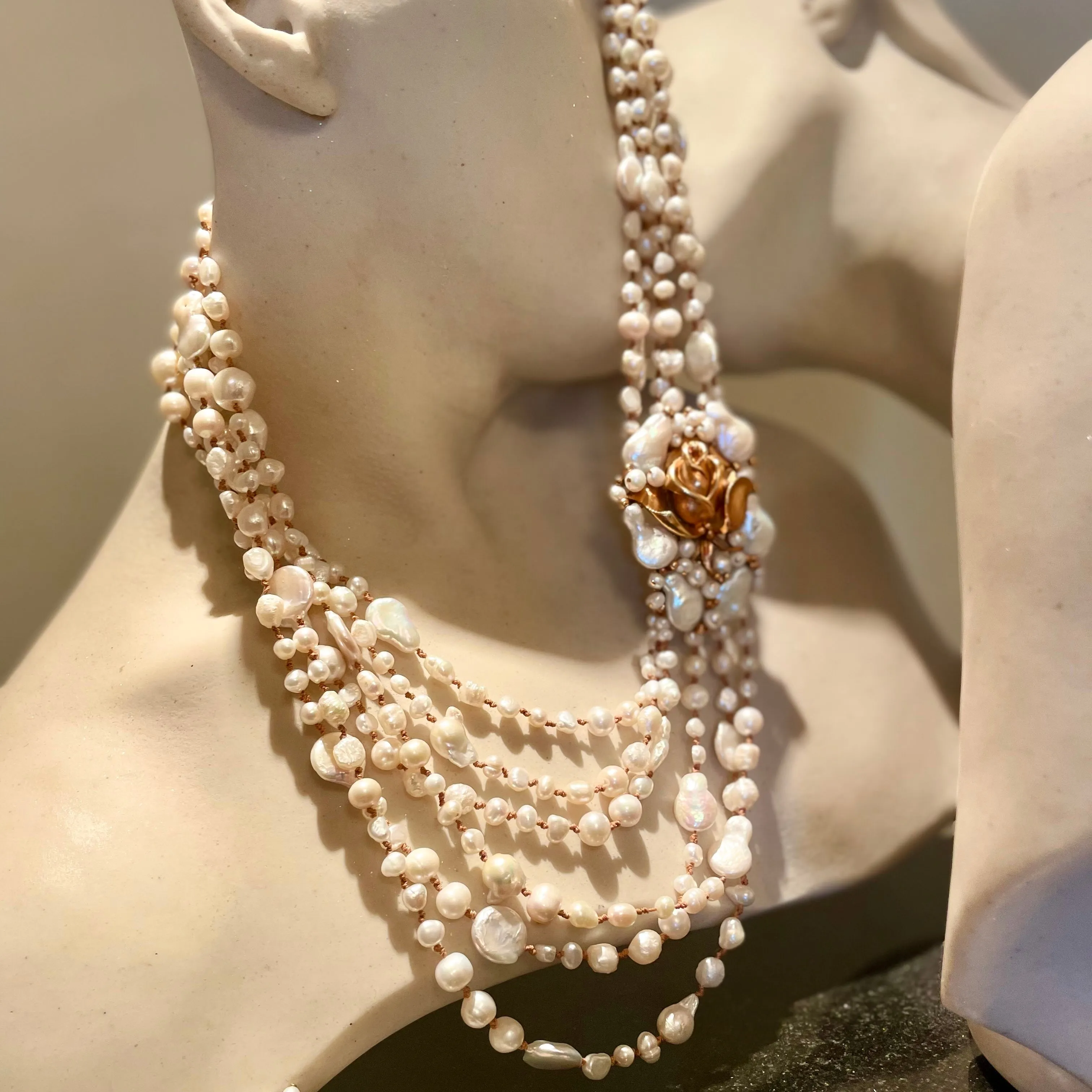 Pearl crochet necklace with brass medallion